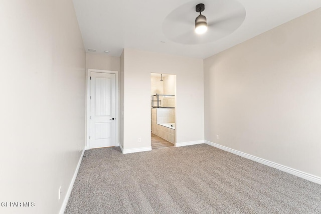 935 Bromyard Dr, Horizon City, TX 79928 - unfurnished bedroom with visible vents, connected bathroom, baseboards, carpet flooring, and a ceiling fan