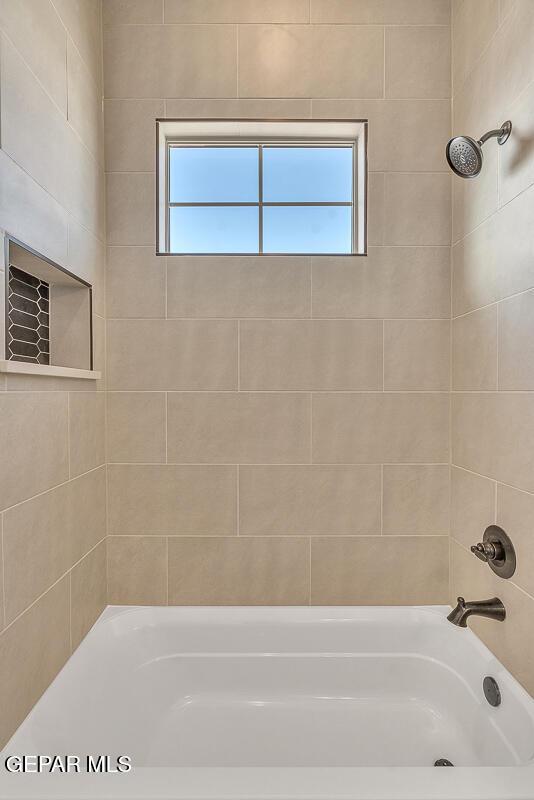 full bathroom featuring washtub / shower combination