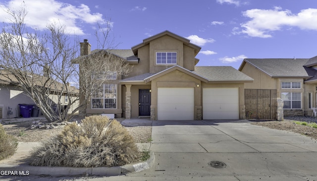 view of front of house featuring a shingled roof, a garage, driveway, and stucco siding