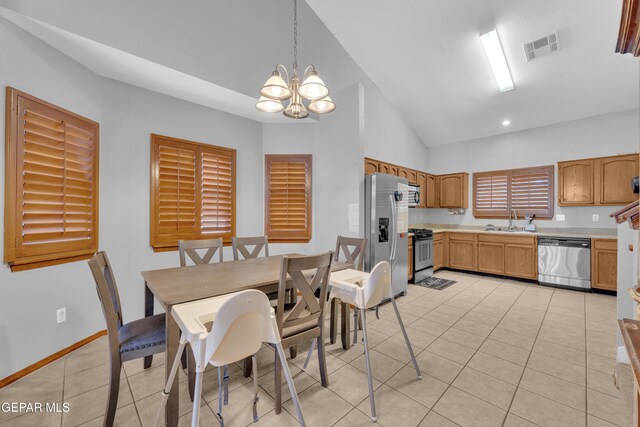 dining space with visible vents, baseboards, vaulted ceiling, light tile patterned flooring, and a notable chandelier