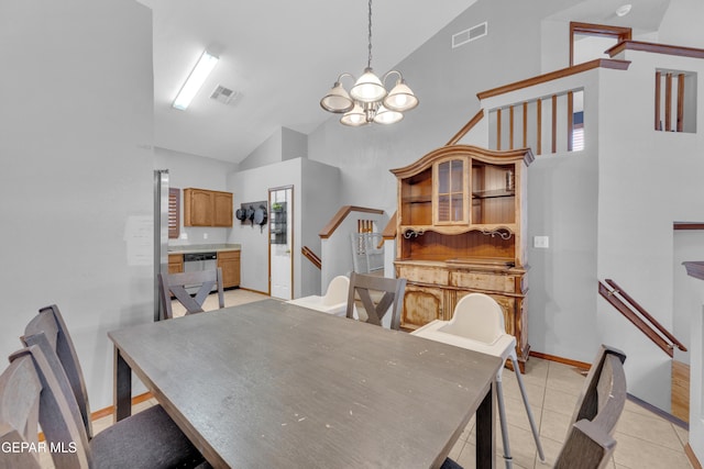 dining space with stairway, light tile patterned floors, visible vents, and high vaulted ceiling