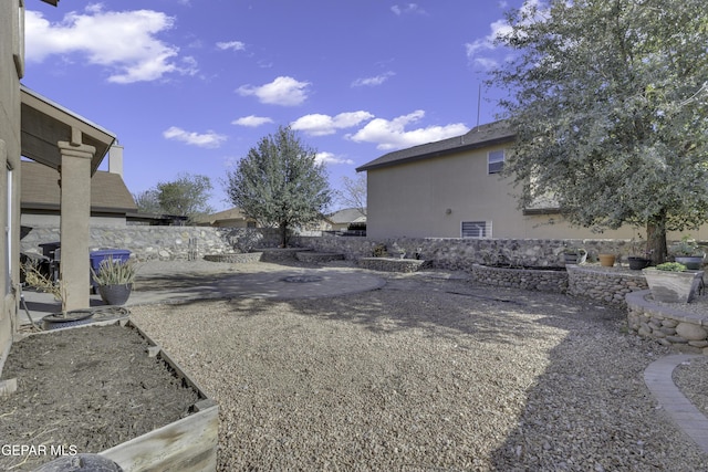 view of yard featuring a patio area and fence