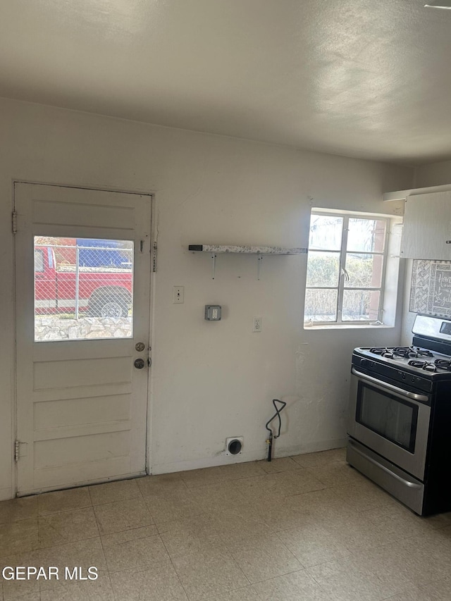 kitchen with white cabinetry and stainless steel gas range