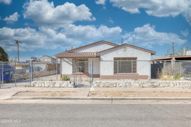 5930 Cleveland Ave, El Paso, TX 79905 - view of front of home with a gate and a fenced front yard