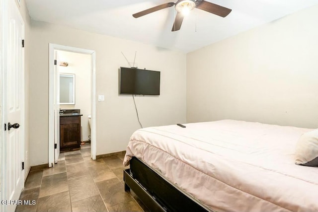 bedroom with a ceiling fan and baseboards