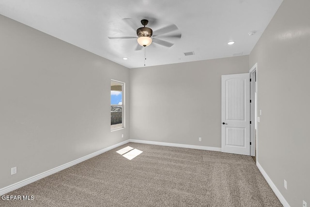 carpeted spare room with recessed lighting, visible vents, baseboards, and ceiling fan