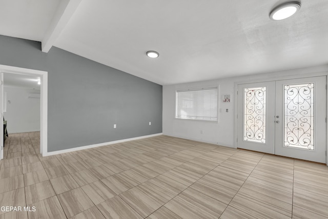 foyer featuring french doors, vaulted ceiling with beams, and baseboards