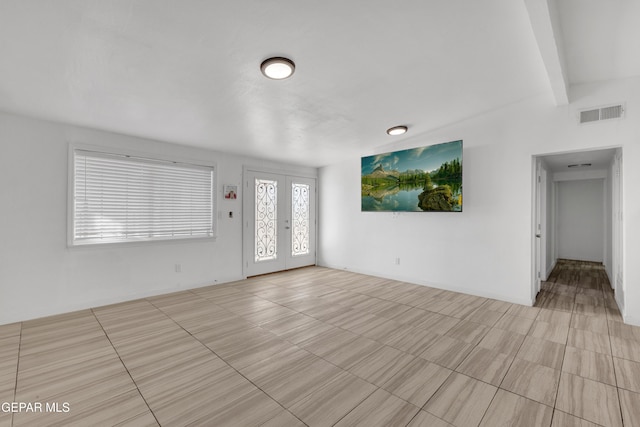 foyer featuring visible vents and french doors