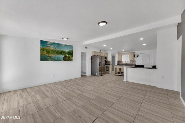 unfurnished living room with a sink, beamed ceiling, visible vents, and recessed lighting