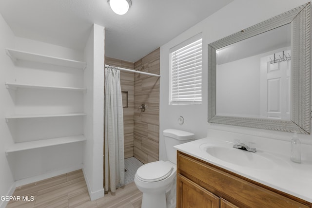 full bath with toilet, a stall shower, and vanity