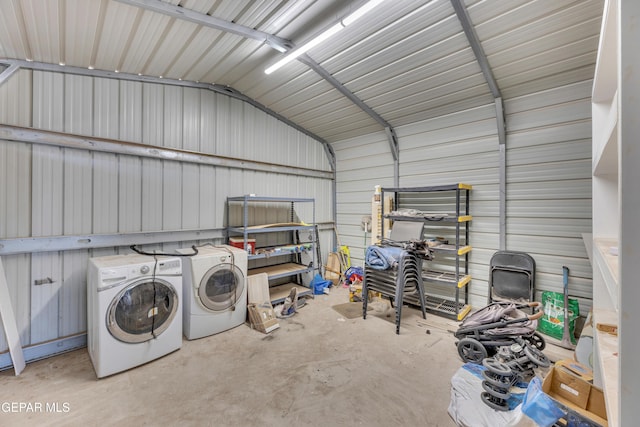 garage with separate washer and dryer and metal wall