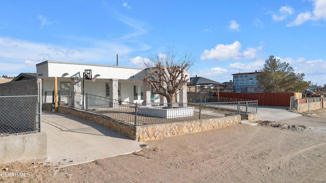 view of front of house featuring fence