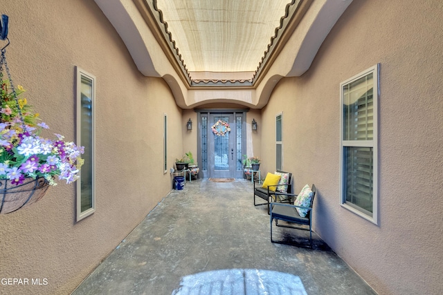 view of exterior entry with stucco siding