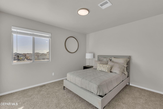 bedroom featuring visible vents, carpet floors, and baseboards