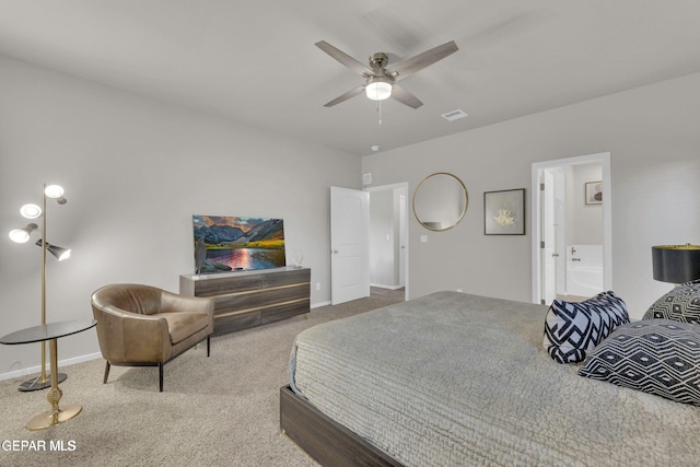 carpeted bedroom featuring visible vents, baseboards, and connected bathroom