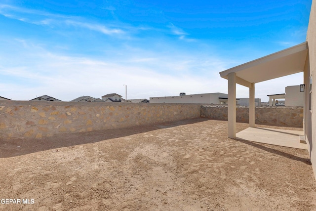 view of yard featuring a patio area and a fenced backyard