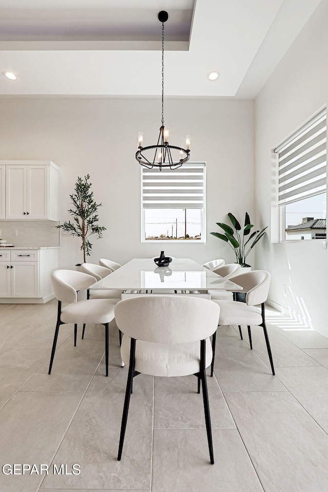 dining room with plenty of natural light, recessed lighting, and an inviting chandelier