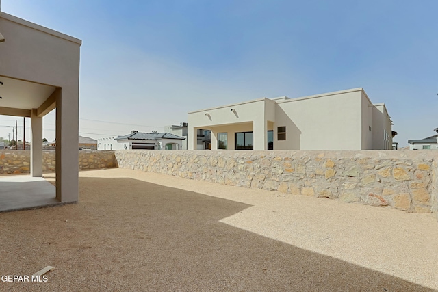 view of yard featuring a patio area and fence