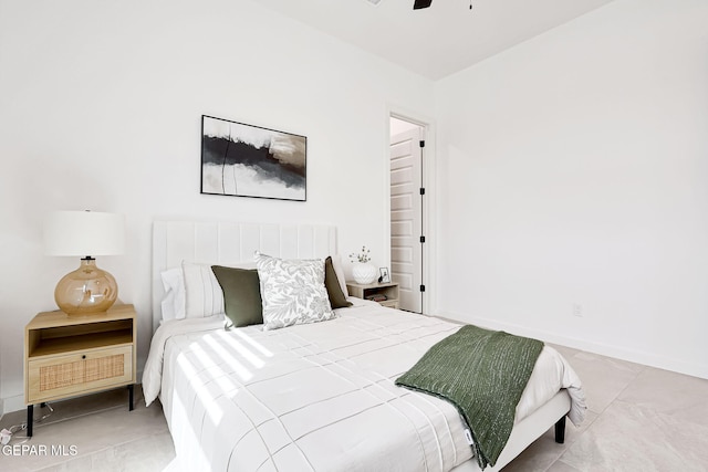 bedroom featuring baseboards and ceiling fan