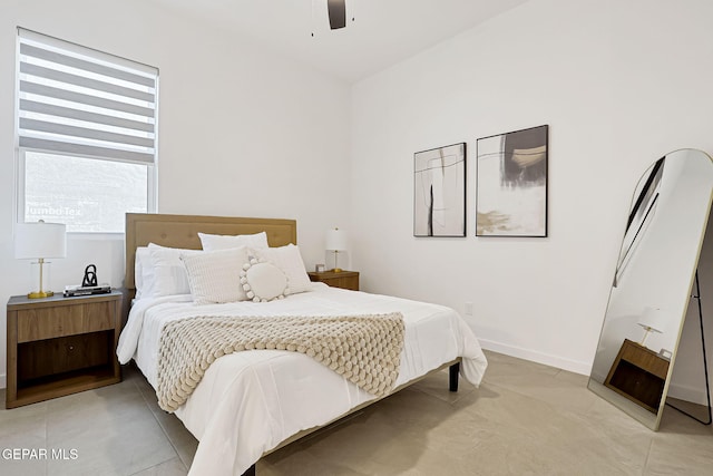 bedroom featuring baseboards and ceiling fan