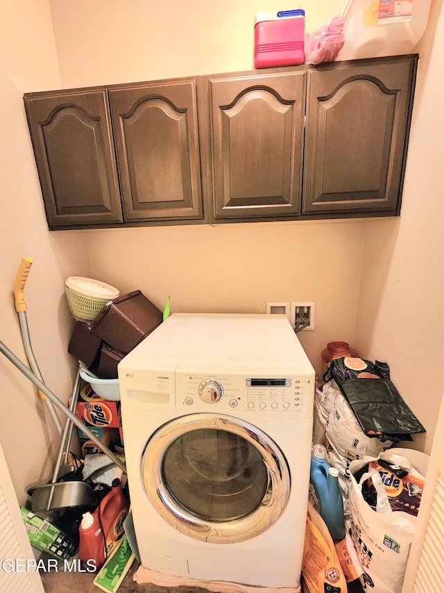 laundry area with washer / clothes dryer and cabinet space