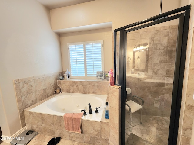 bathroom featuring a jetted tub and a stall shower