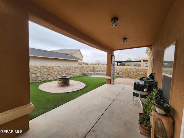 view of patio / terrace featuring a fenced backyard and an outdoor fire pit