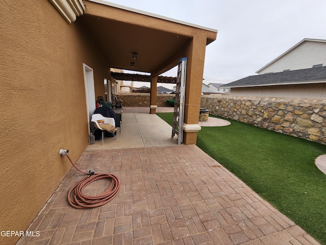 view of patio with fence