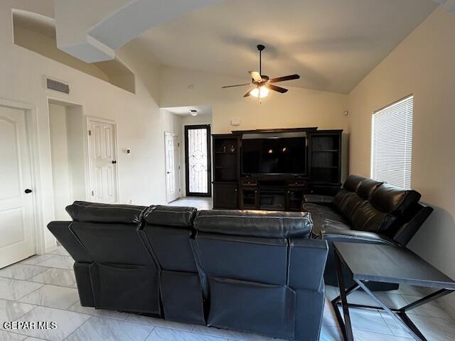 living room featuring visible vents, marble finish floor, ceiling fan, and vaulted ceiling