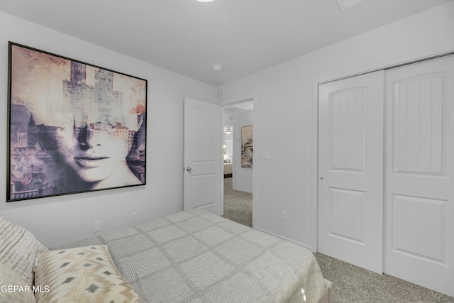 carpeted bedroom with a closet