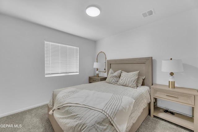 carpeted bedroom with baseboards and visible vents