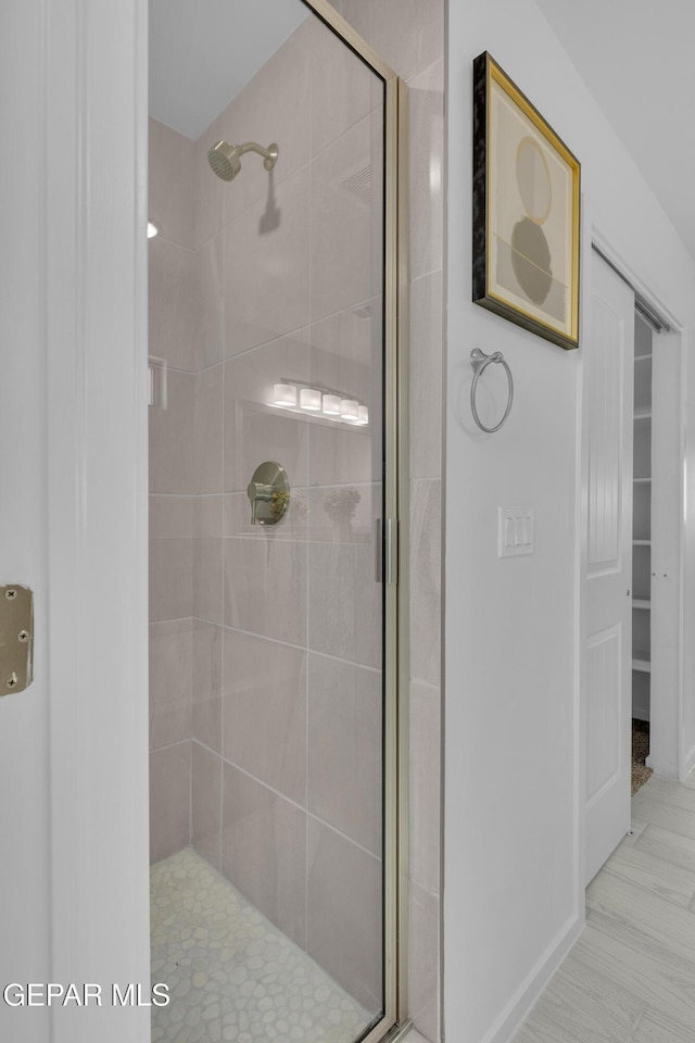 bathroom featuring a stall shower