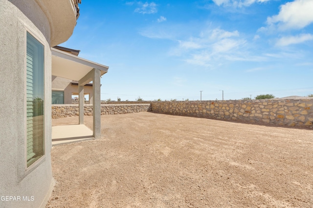 view of yard featuring a patio and a fenced backyard