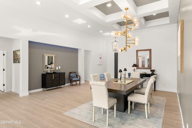 dining room with recessed lighting, light wood-style floors, a notable chandelier, and coffered ceiling