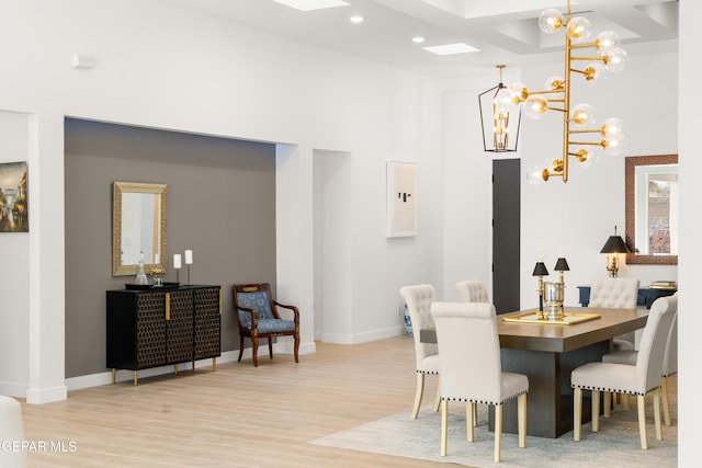 dining room featuring a high ceiling, recessed lighting, wood finished floors, and baseboards