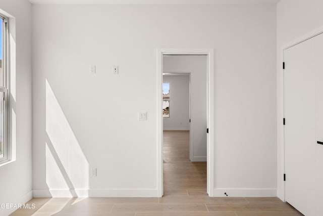 interior space with light wood-style flooring and baseboards