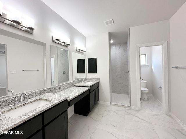 full bathroom featuring toilet, marble finish floor, and a marble finish shower