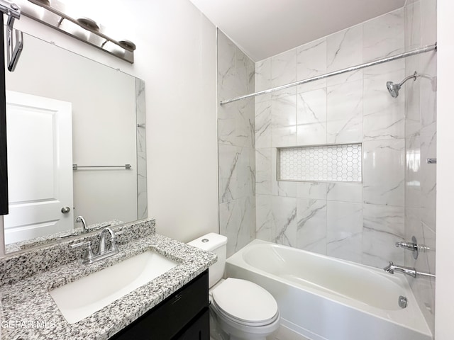 bathroom featuring vanity, toilet, and shower / bathing tub combination