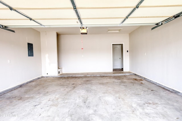 garage with electric panel and a garage door opener