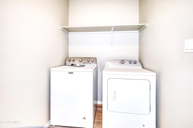 laundry area with laundry area and separate washer and dryer