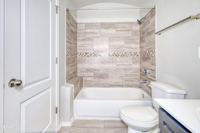 bathroom featuring shower / bath combination, toilet, and vanity