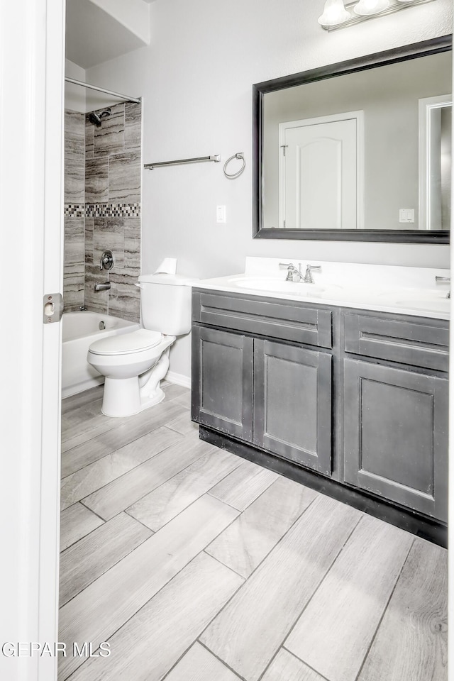 1722 Breeder Cup Way, El Paso, TX 79928 - bathroom with double vanity, toilet, shower / tub combination, and wood tiled floors