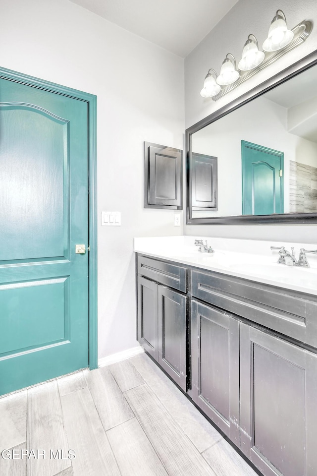 1722 Breeder Cup Way, El Paso, TX 79928 - full bathroom with double vanity, wood finished floors, and baseboards