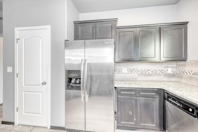 1722 Breeder Cup Way, El Paso, TX 79928 - kitchen featuring stainless steel appliances, decorative backsplash, and gray cabinetry