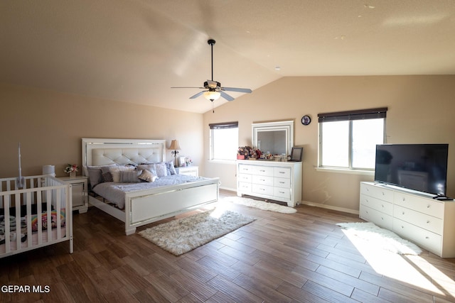 bedroom featuring a ceiling fan, vaulted ceiling, wood finished floors, and baseboards