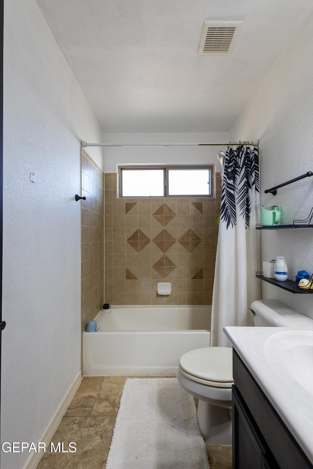 bathroom featuring visible vents, baseboards, toilet, vanity, and shower / bathtub combination with curtain