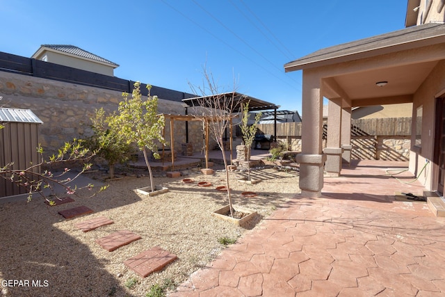 view of yard featuring a gazebo, a fenced backyard, and a patio area