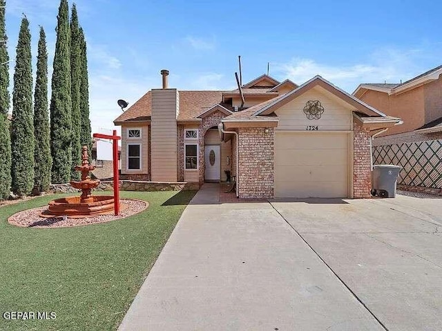 ranch-style house featuring an attached garage, a chimney, concrete driveway, a front lawn, and brick siding