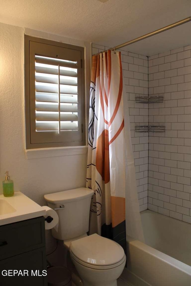 full bath featuring toilet, shower / bath combo, and vanity