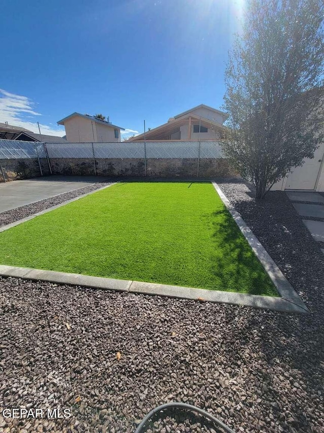 view of yard with a fenced backyard